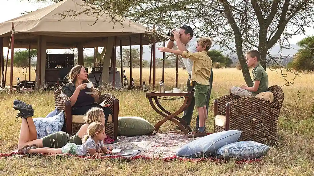 Family safari Tanzania with children watching wildlife