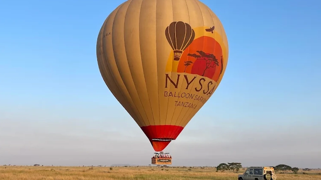 Hot air balloon safari Serengeti sunrise flight over wildlife